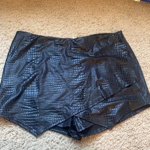 Never worn, women’s black skort! Leather material.